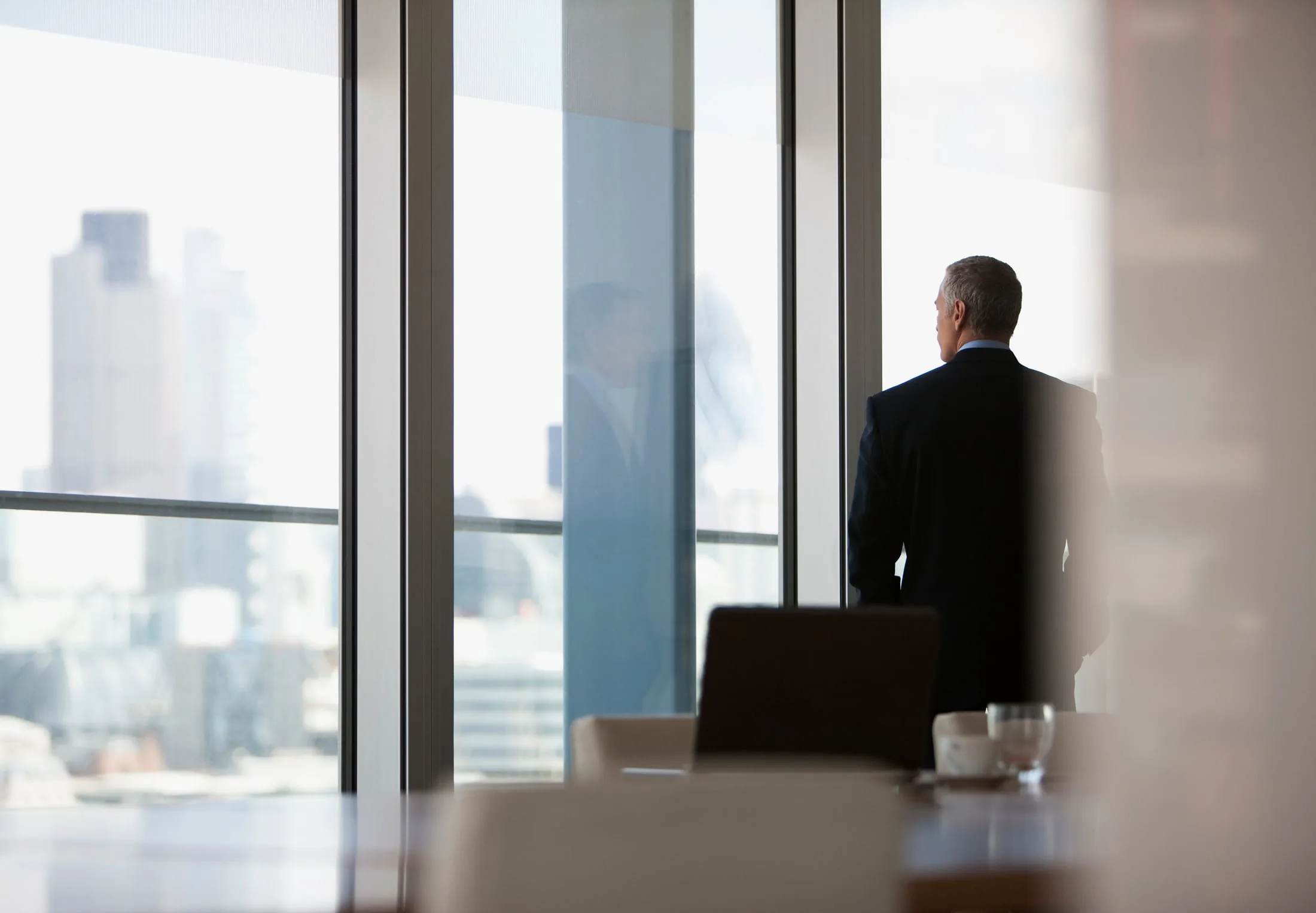 An executive taking in the city view from a C View office